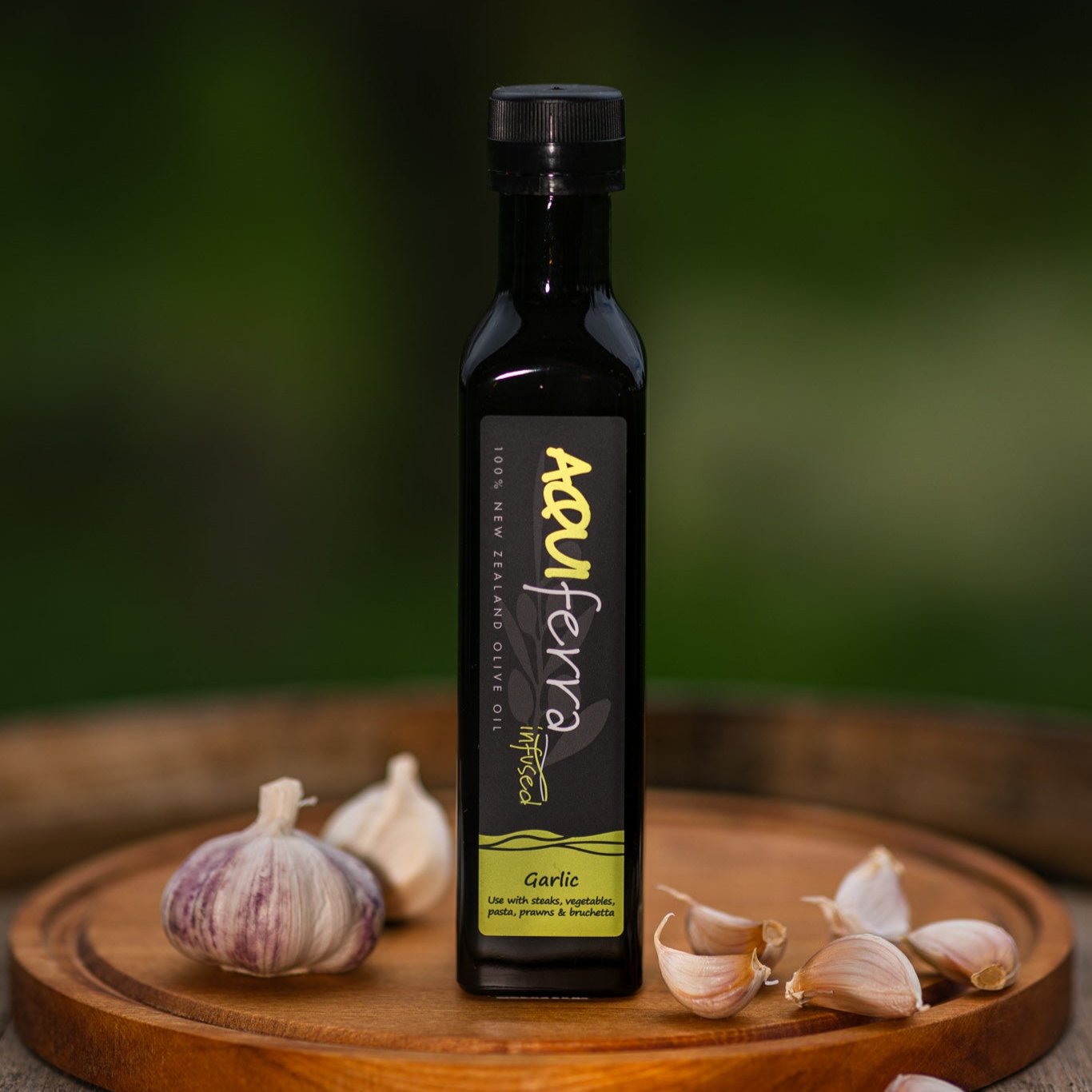 Aquiferra Garlic infused olive oil bottle, rich and aromatic, perfect for steaks, vegetables, pasta, prawns, and bruschetta.