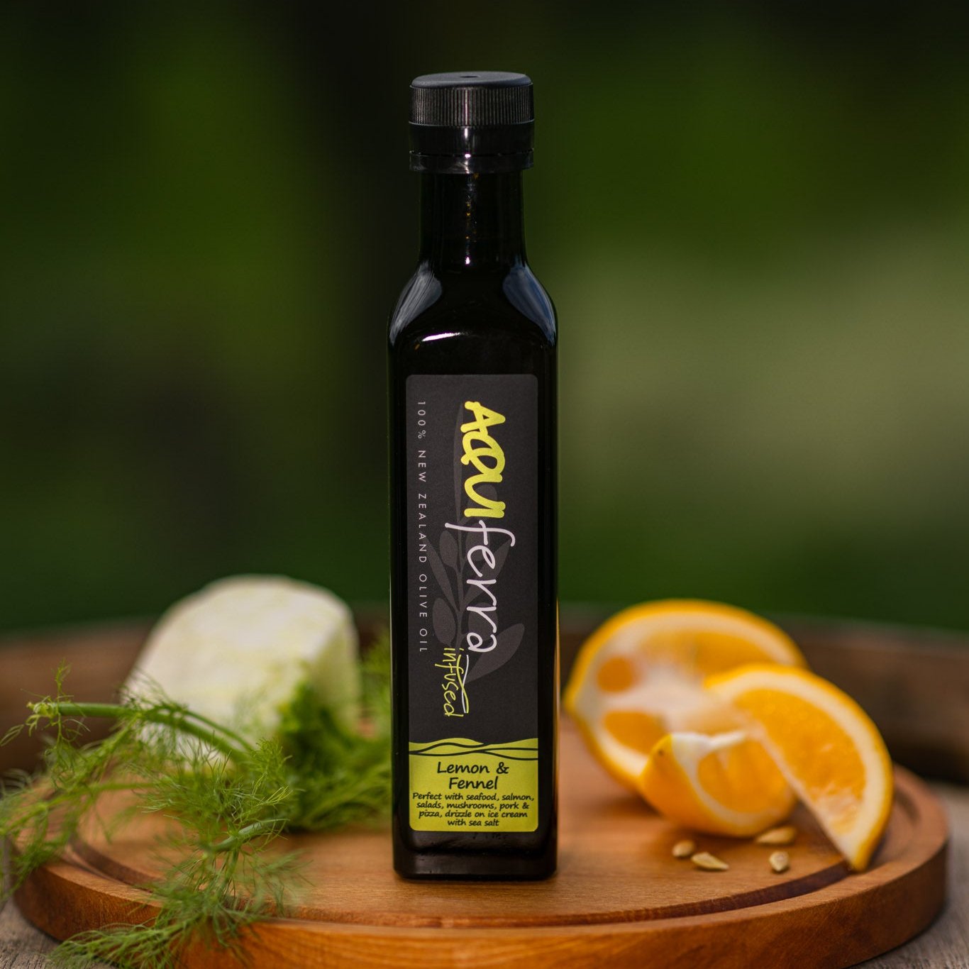 Aquiferra Lemon & Fennel olive oil bottle, with a subtle citrus and aromatic fennel flavor, great for seafood, salads, mushrooms, pork, pizza, and desserts like vanilla ice cream.