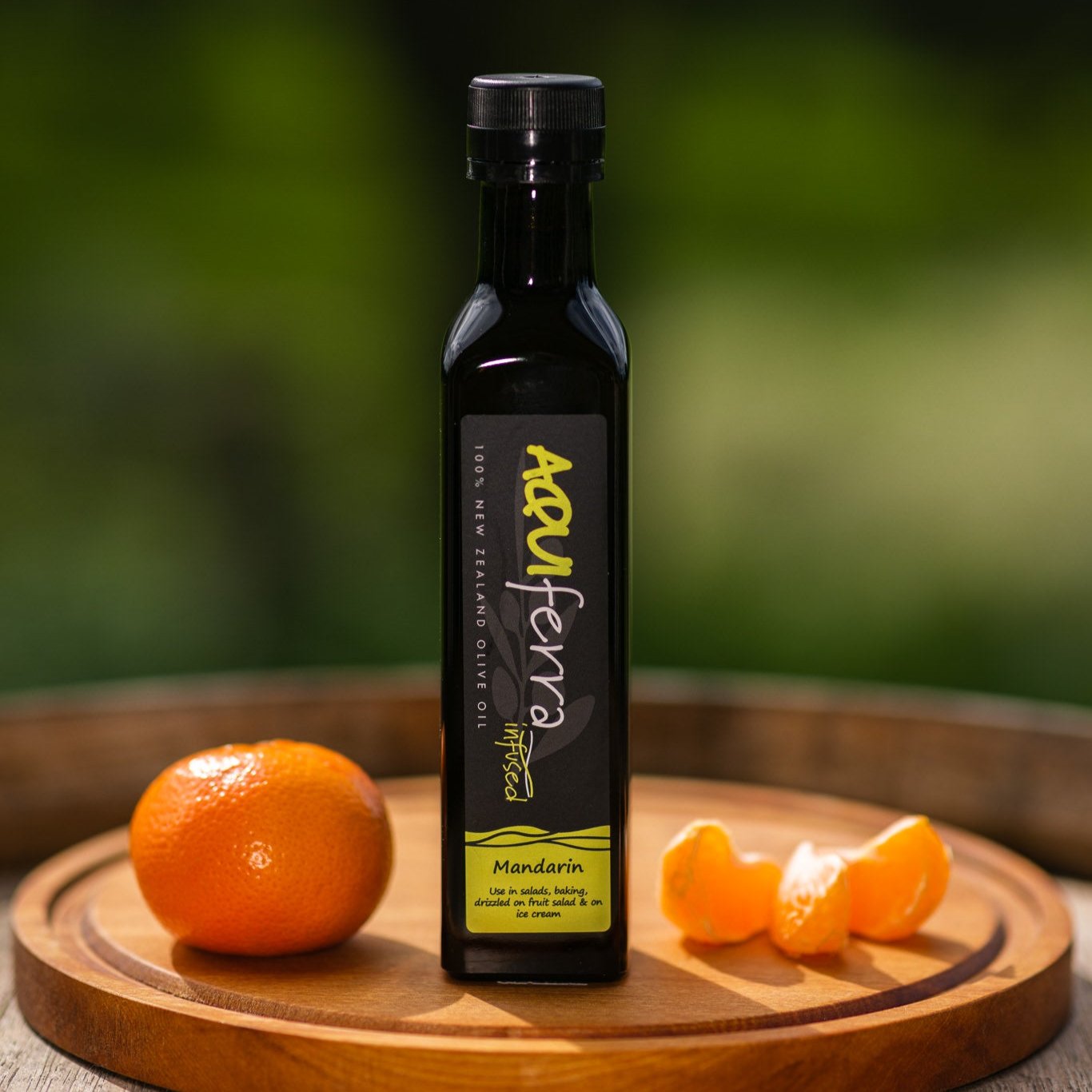 Aquiferra Mandarin olive oil bottle, sweet and aromatic, perfect for salads, fruit salads, baking, muesli, porridge, and desserts.